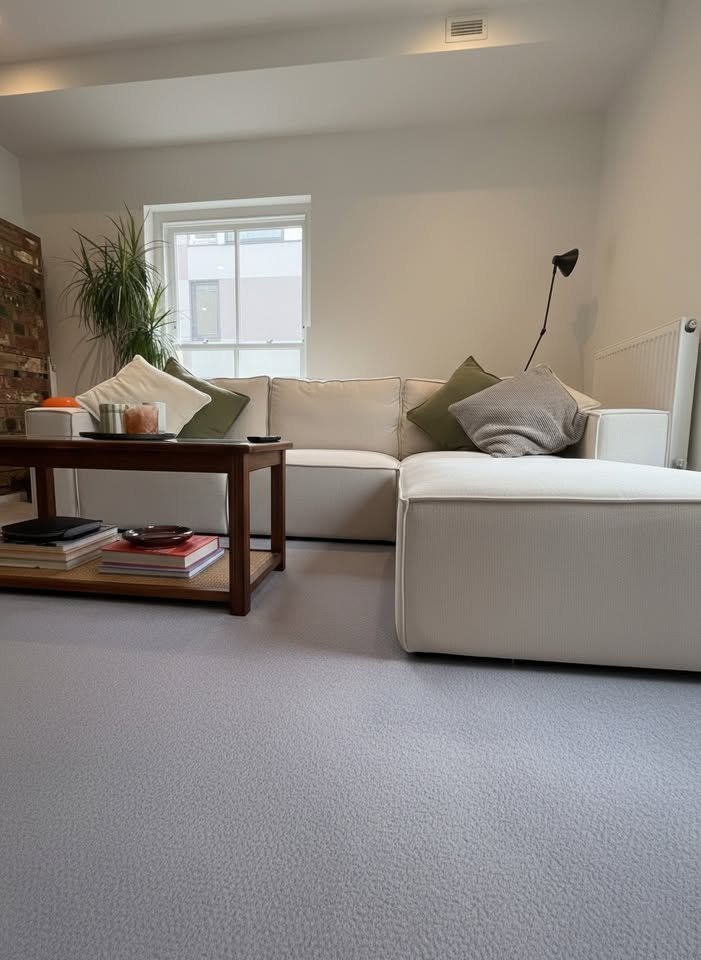 White L-Shaped Sofa with Footstool and Throw Pillows606182571886530561