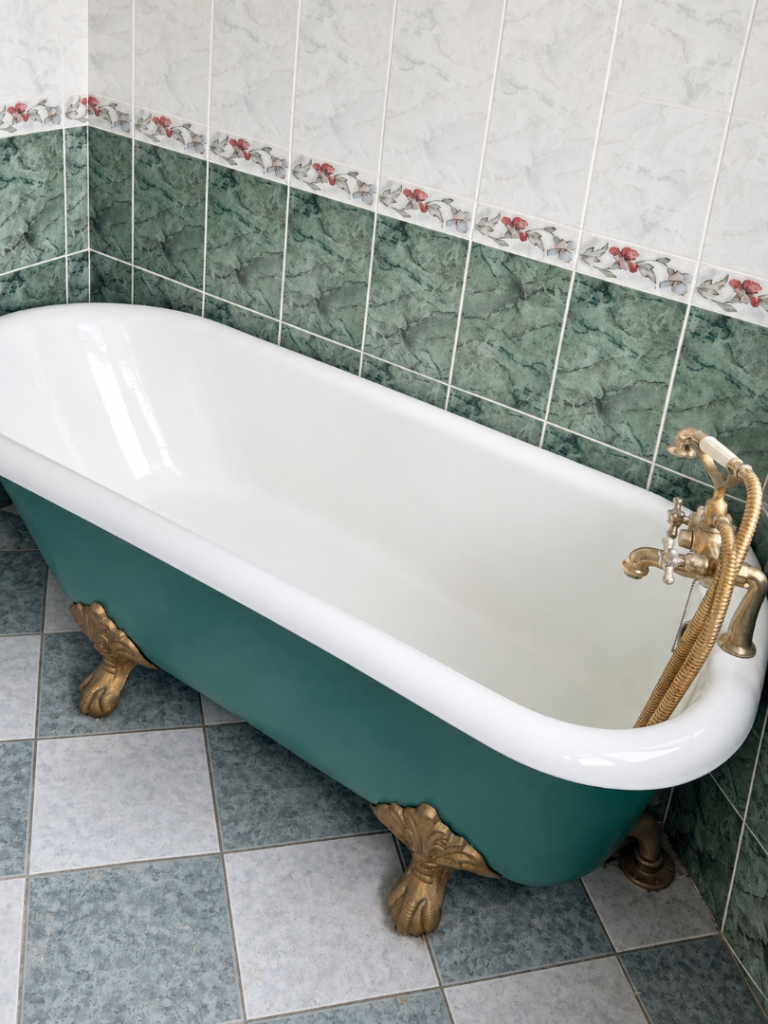 Cast-iron roll-top bath with claw feet, collection only